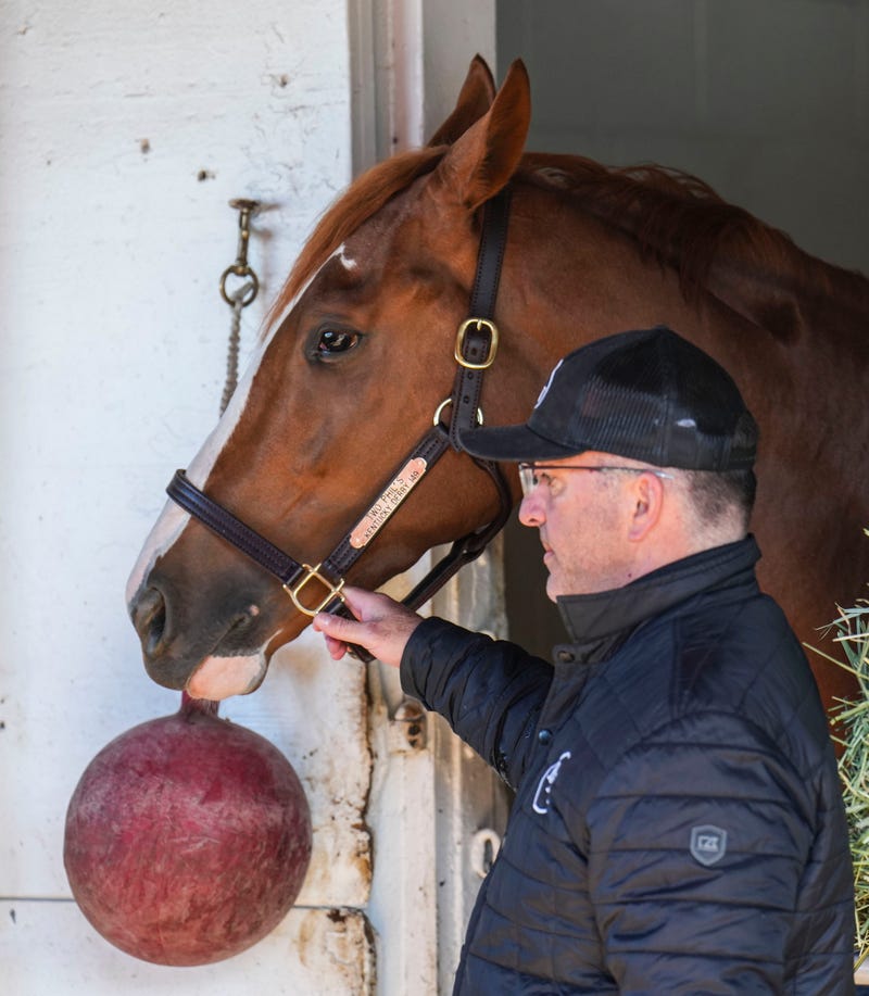 May 2, 2023; Louisville, KY, USA; Kentucky Derby hopeful Two Phil's stands in his stall with trainer Larry Rivelli nearby after a workout Tuesday morning at Churchill Downs on May 2, 2023, in Louisville, Ky.