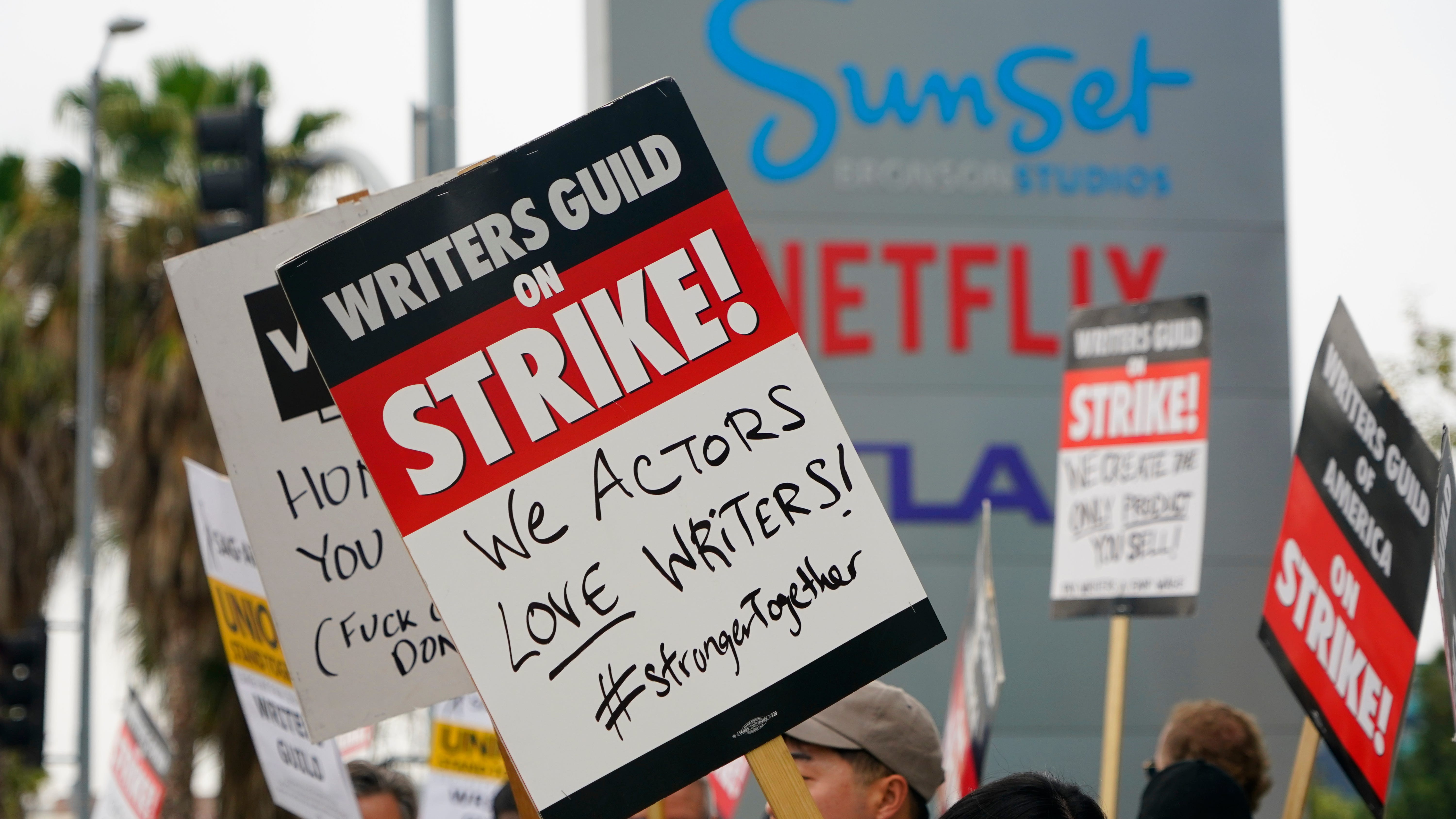Unions join striking Hollywood writers in LA rally