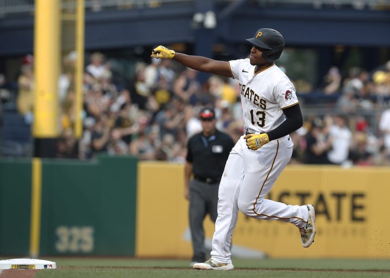 Ke'Bryan Hayes rounding third after hitting HR