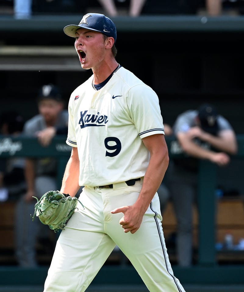 New LSU pitcher Justin Loer (9) celebrates last season when he was with Xavier