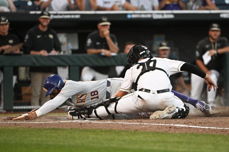 Tre Morgan slides into home