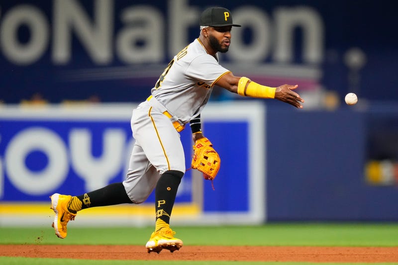 Pittsburgh Pirates shortstop Rodolfo Castro (14) throws the ball into second base