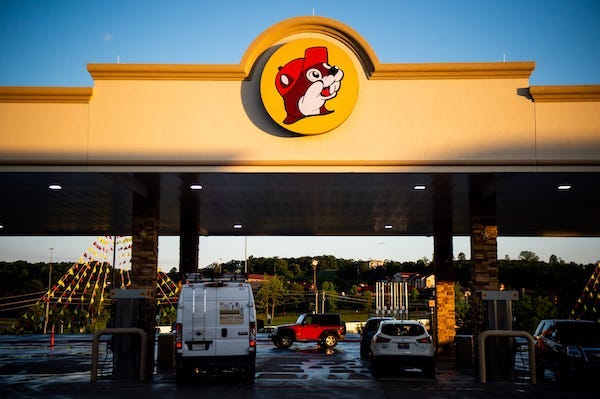 Customers get gas at one of the many gas pumps at Buc-ee's during the grand opening of Buc-ee's in Sevierville on Monday, June 26, 2023