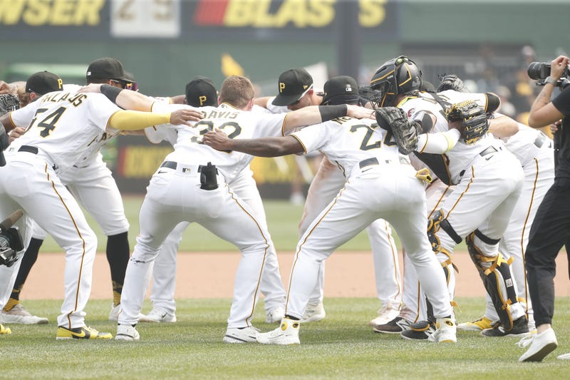 Pirates celebrate in huddle after win