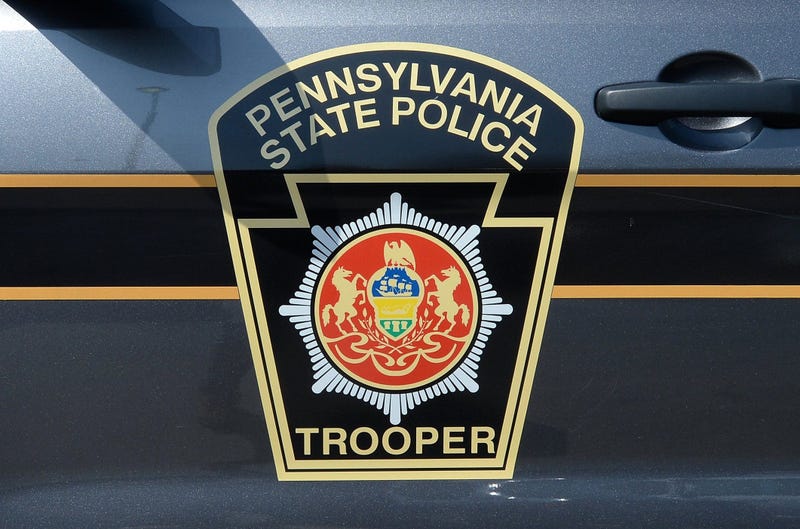 Pennsylvania State Police logo on the side of a police cruiser.