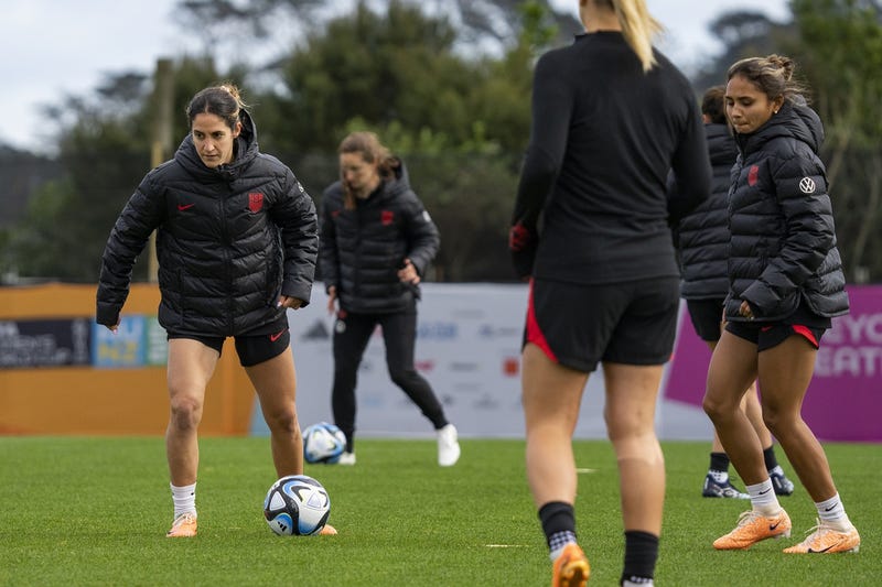 United States midfielder Savannah DeMelo (9), left, works through a drill during a training session at Bay City Park amid the 2023 FIFA Women's World Cup.