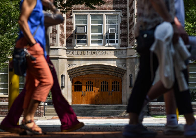 Prospective students and their parents pass by Berkey Hall on the campus of Michigan State University, on Tuesday, Aug. 8, 2023.