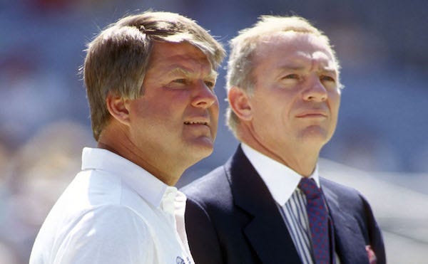 Dallas Cowboys head coach Jimmy Johnson and owner Jerry Jones talk prior to a game against the Atlanta Falcons