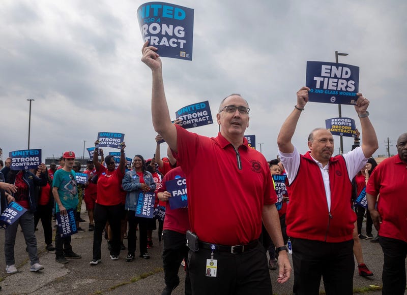 UAW President Shawn Fain marches alongside other union members during a rally and practice picket near the Detroit Assembly Complex - Mack in Detroit on Wednesday, Aug. 23, 2023.
