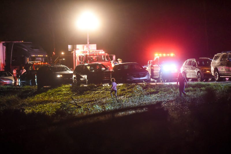 Cars stopped along I-96 after a storm caused damage on Thursday, Aug. 24, 2023, south east of Williamston