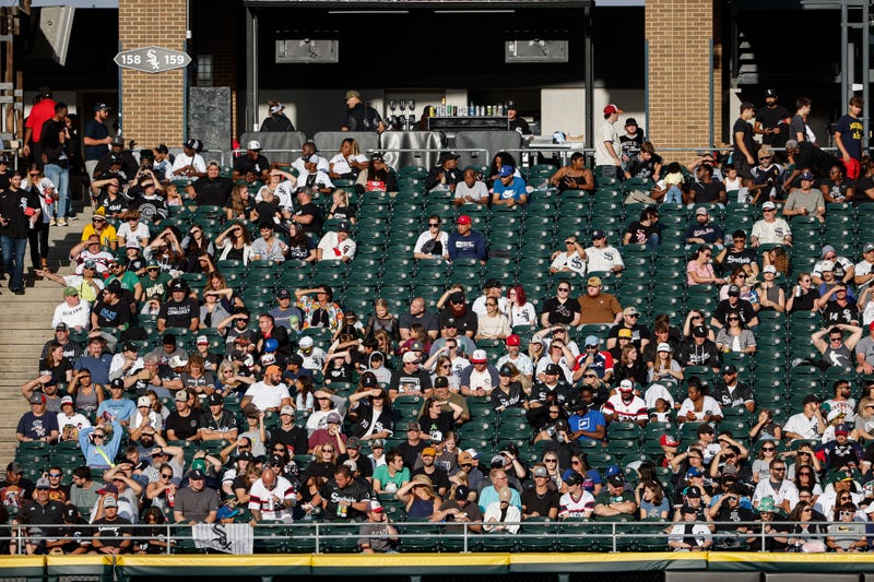 Fans watch a baseball game between the Chicago White Sox and Oakland Athletics from the left-field bleachers during the first inning at Guaranteed Rate Field.