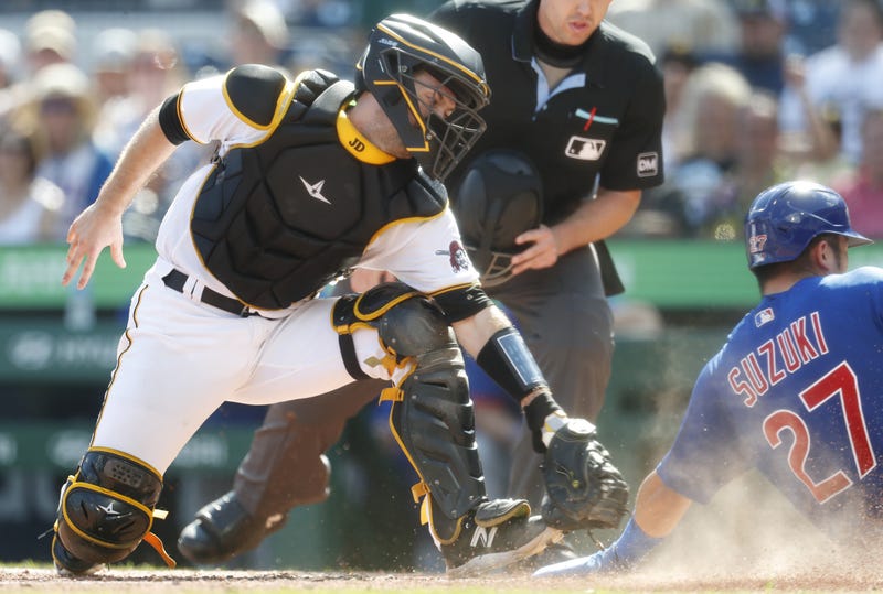 Jason Delay catching with runner sliding