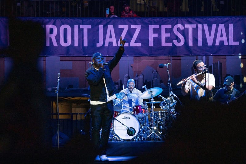 Wildchild, left, performs with Karriem Riggins, 2023 Rocket Mortgage artist-in-residence, and Kasan Belgrave during opening night of the Detroit Jazz Festival at Hart Plaza in downtown Detroit on Friday, Sept 1, 2023.