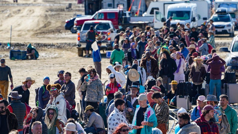 Hundreds of Burning Man attendees who planned to leave on buses wait for information about when they will be able to leave on Labor Day.