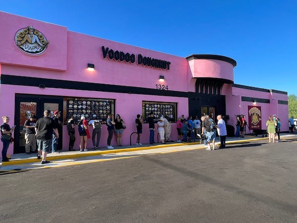 Customers lined up outside Voodoo Doughnut