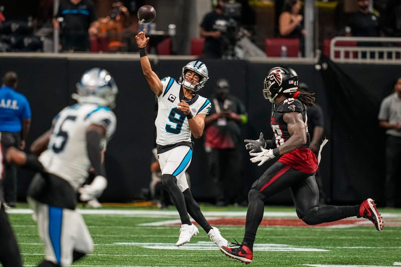 Carolina Panthers quarterback Bryce Young (9) throws the ball away while under pressure from the Atlanta Falcons during the second half