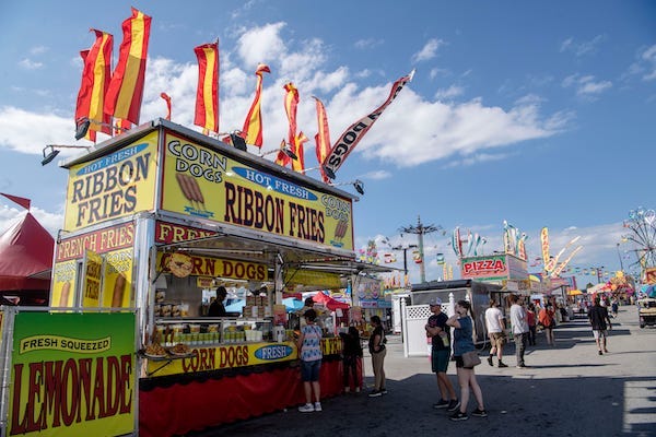 Look out for the red and yellow flags flying to find a popular fair food and returning vendor, Hot Fresh Ribbon Fries, at the NC Mountain State Fair