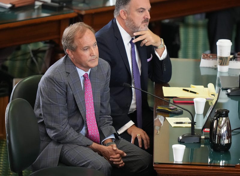 Attorney General Ken Paxton, left, and his attorney Mitch Little listen to closing arguments at his impeachment trial at the Capitol on Friday, Sept. 15, 2023.