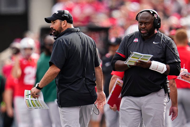 Ohio State Buckeyes head coach Ryan Day and running backs coach Tony Alford watch from the sideline during the NCAA football game against the Western Kentucky Hilltoppers at Ohio Stadium. 