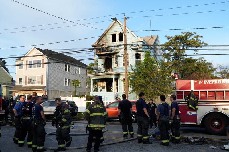 Firefighters respond to the scene of the fire on Madison Avenue on Wednesday. The fire displaced more than a dozen residents.