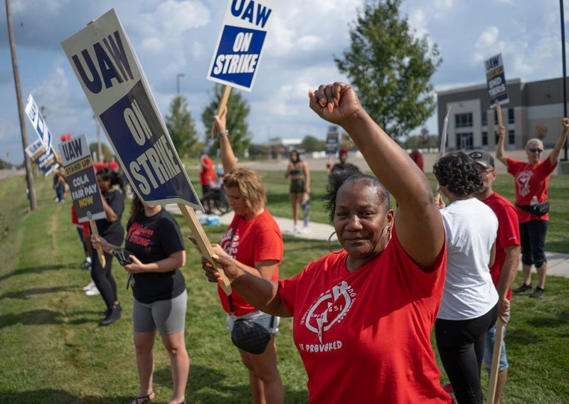 General Motors employee Ladonia Robbs, right, of Flint stands with co-workers while on strike outside of GM's Davison Road Processing Center in Burton