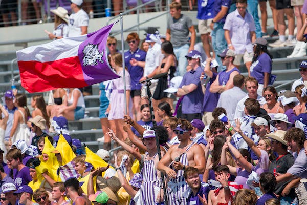 A view of the TCU Horned Frogs fans and students and Texas flag during the second half of the game between the TCU Horned Frogs and the SMU Mustangs at Amon G. Carter Stadium