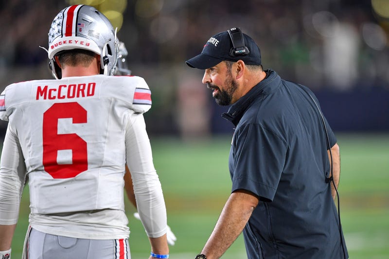 Ohio State Buckeyes head coach Ryan Day talks to quarterback Kyle McCord (6) in the game against the Notre Dame Fighting Irish at Notre Dame Stadium.