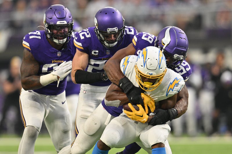 Chargers RB Joshua Kelley is tackled by Minnesota Vikings DE/LB Danielle Hunter