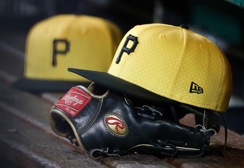 ; Pittsburgh Pirates hats and gloves in the dugout against the New York Yankees 