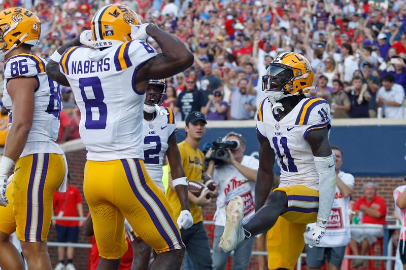 LSU Tigers wide receiver Brian Thomas Jr. (11) reacts with LSU Tigers wide receiver Malik Nabers (8)