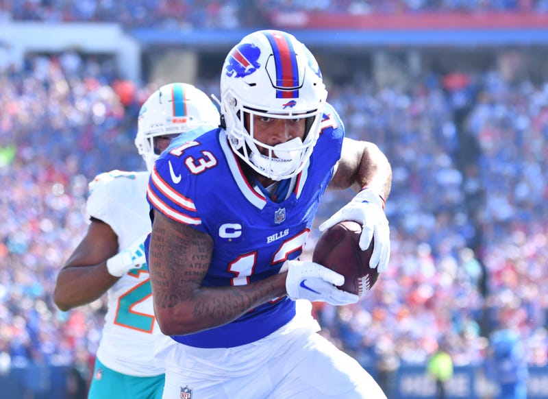 Buffalo Bills wide receiver Gabe Davis (13) scores a touchdown against the Miami Dolphins in the first quarter at Highmark Stadium.