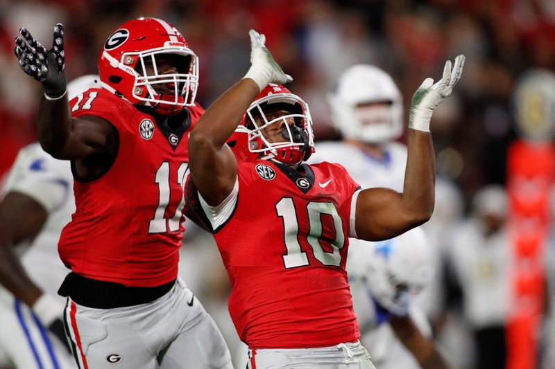 Georgia LB Jamon Dumas-Johnson celebrate after sacking Kentucky QB Devin Leary