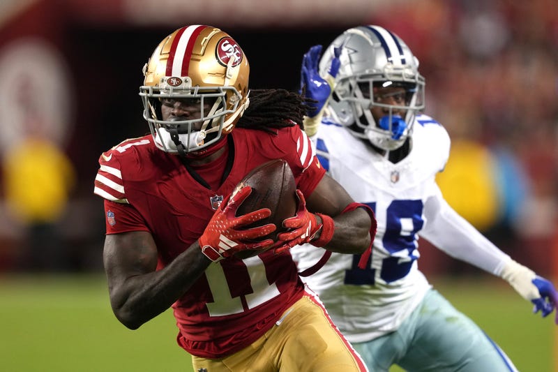 Caption: Oct 8, 2023; Santa Clara, California, USA; San Francisco 49ers wide receiver Brandon Aiyuk (11) runs after a catch against Dallas Cowboys cornerback Noah Igbinoghene (19) during the third quarter at Levi's Stadium