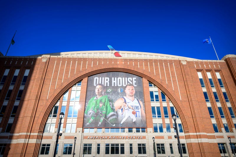 A view of an American Airlines Center exterior banner with an image of Dallas Stars left wing Jason Robertson (left) and Dallas Mavericks guard Luka Doncic (right).