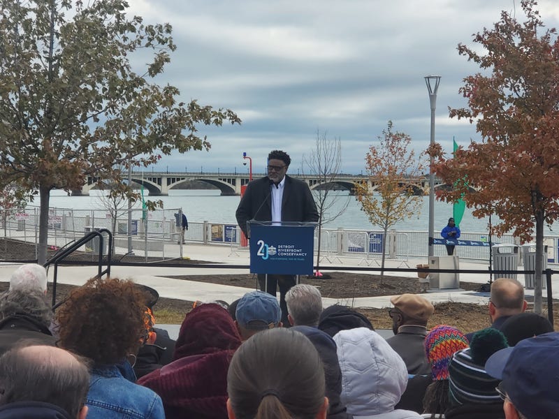 Ex-Detroit Riverfront Conservancy CFO William Smith speaks to attendees ahead of the Uniroyal Promenade ribbon-cutting ceremony Saturday morning on the Detroit Riverwalk.