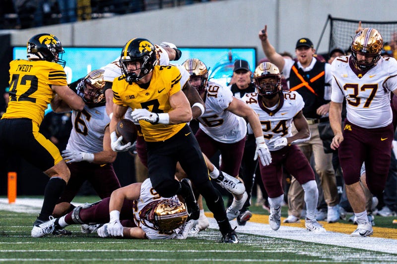 Iowa defensive back Cooper DeJean (3) runs back a punt for a touchdown at Kinnick Stadium on Saturday, October 21, 2023 in Iowa City. 