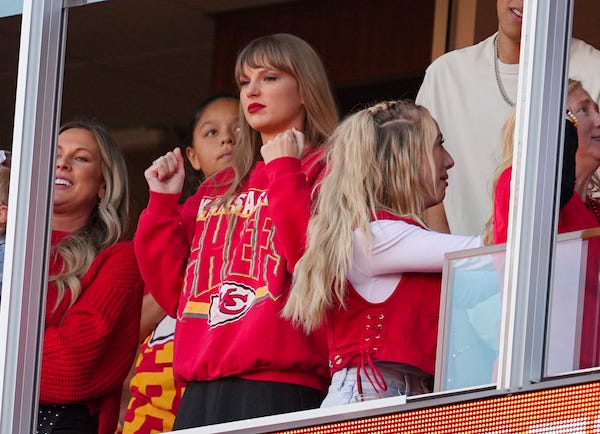 Recording artist Taylor Swift and Brittany Mahomes cheer during the second half between the Los Angeles Chargers and the Kansas City Chiefs at GEHA Field at Arrowhead Stadium