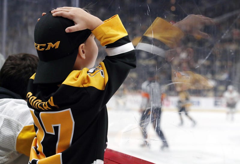 Upset young Pens fan