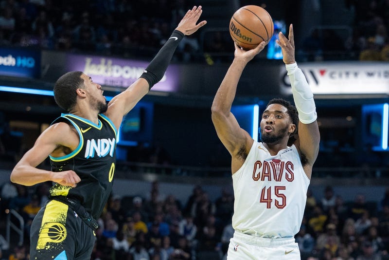 Cleveland Cavaliers guard Donovan Mitchell (45) shoots while Indiana Pacers guard Tyrese Haliburton (0) defends at Gainbridge Fieldhouse.