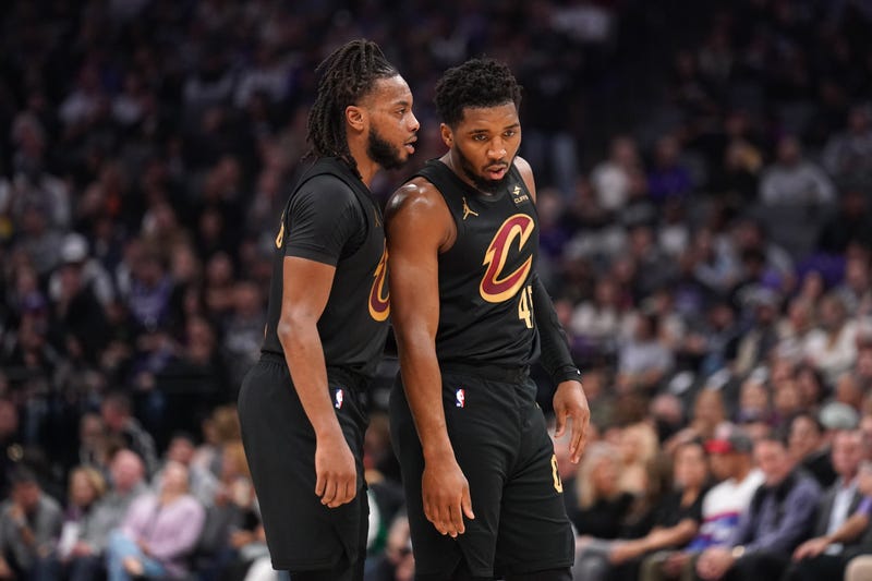 Cleveland Cavaliers guard Darius Garland (10) talks with guard Donovan Mitchell (45).