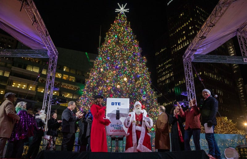 Santa Claus, Mayor Mike Duggan and others stand on stage during the 20th Annual Tree Lighting in downtown Detroit o
