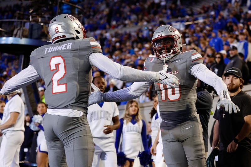 UNLV Rebels linebacker Fred Thompkins Jr. (10) celebrates after a play with defensive back Jaxen Turner (2) in the fourth quarter against the Air Force Falcons at Falcon Stadium.