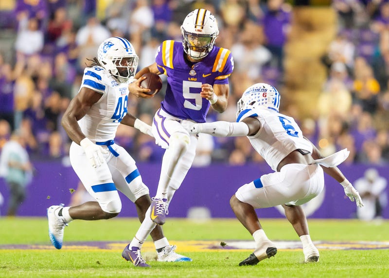 Jayden Daniels 5 runs the ball as the LSU Tigers take on Georgia State in Tiger Stadium in Baton Rouge
