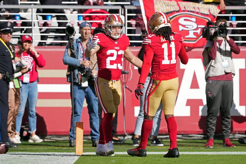 Nov 19, 2023; Santa Clara, California, USA; San Francisco 49ers running back Christian McCaffrey (23) celebrates with wide receiver Brandon Aiyuk (11) after scoring a touchdown against the Tampa Bay Buccaneers during the first quarter at Levi's Stadium