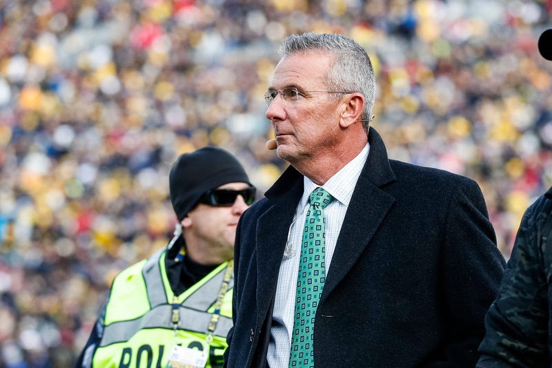 Ohio State Buckeyes former head coach Urban Meyer walks by the end zone during the first half between Michigan and Ohio State at Michigan Stadium in Ann Arbor on Saturday, Nov. 25, 2023. 