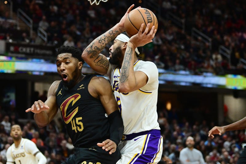 Nov 25, 2023; Cleveland, Ohio, USA; Los Angeles Lakers forward Anthony Davis (3) drives to the basket against Cleveland Cavaliers guard Donovan Mitchell (45) during the second half at Rocket Mortgage FieldHouse.