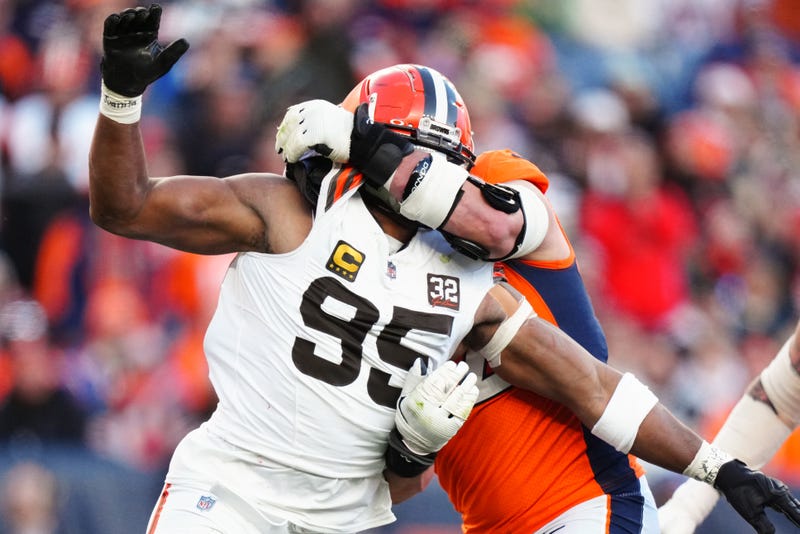 Denver Broncos offensive tackle Garett Bolles (72) holds Cleveland Browns defensive end Myles Garrett (95) in the second quarter at Empower Field at Mile High. 