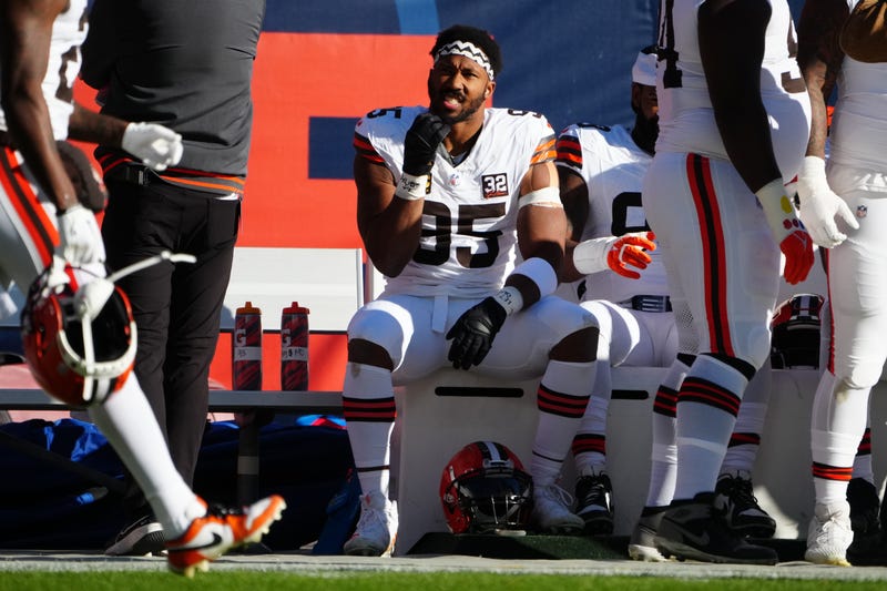 Cleveland Browns defensive end Myles Garrett (95) sits on the bench in the second half against the Denver Broncos at Empower Field at Mile High.  