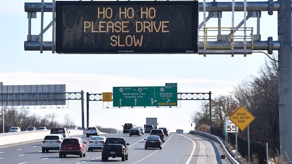 A holiday themed road sign is posted on Route 42 South, near the Route 55 South exit, on Wednesday, November 29, 2023