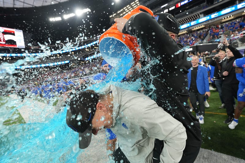 Boise State Broncos head coach Spencer Danielson is doused after 44-20 victory over the UNLV Rebels in the Mountain West Championship at Allegiant Stadium